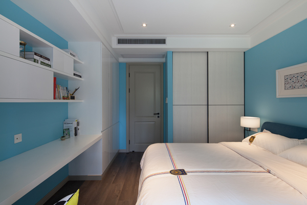 现代清新卧室蓝色背景墙室内装修效果图