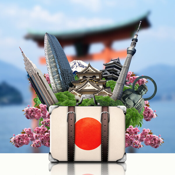 日本国旗旅行箱与城市建筑图片