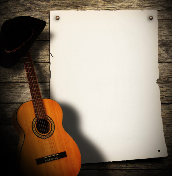 吉他与空白纸背景图片