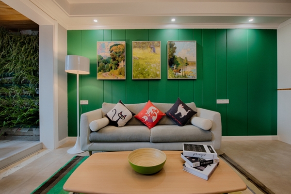 现代时尚客厅亮绿色背景墙室内装修效果图